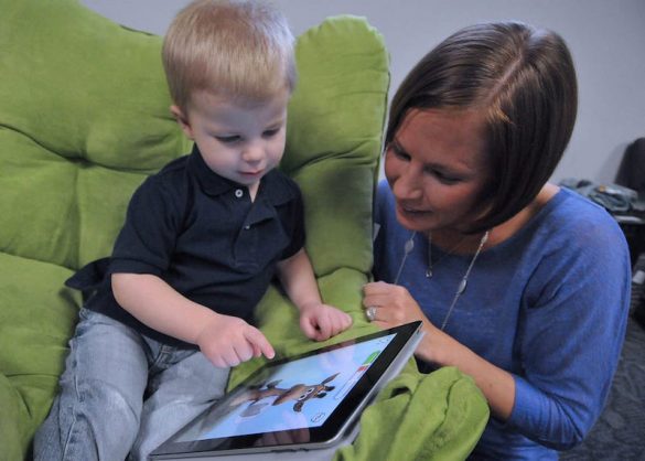 Child and mother with iPad