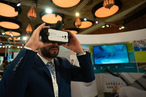 A delegate explores a Virtual Reality device at the WISH 2018 Innovation Hub