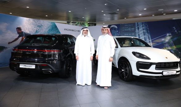 Chairman and CEO Salman Jassem Al Darwish and Brand Manager Ahed Dawood pose with the new Porsche Macan